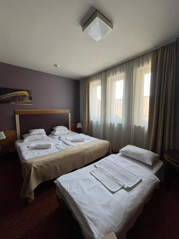 Postel nebo postele na pokoji v ubytování Szent Gellért Hotel