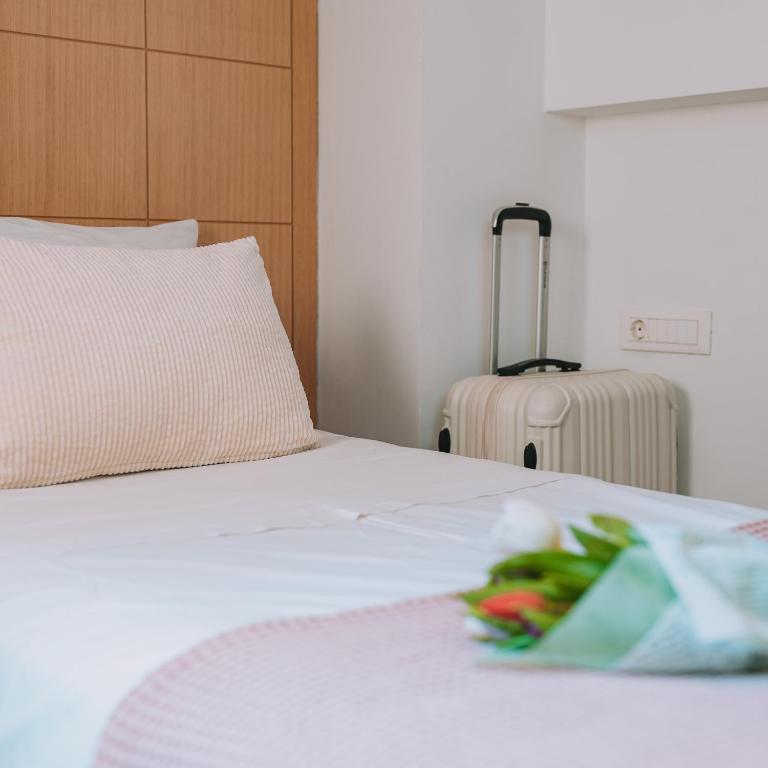 Postel nebo postele na pokoji v ubytování Chic Hotel
