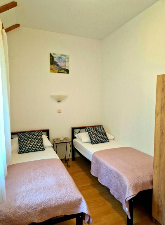 Posteľ alebo postele v izbe v ubytovaní Paula Apartment - Green home by the sea