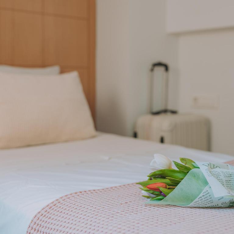Postel nebo postele na pokoji v ubytování Chic Hotel