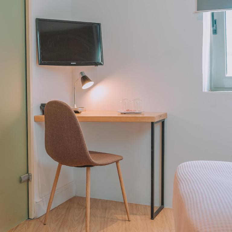 TV a/nebo společenská místnost v ubytování Chic Hotel
