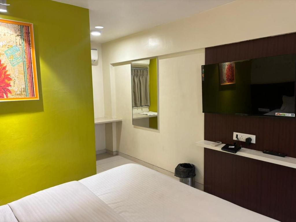 Postel nebo postele na pokoji v ubytování Hotel Haldi