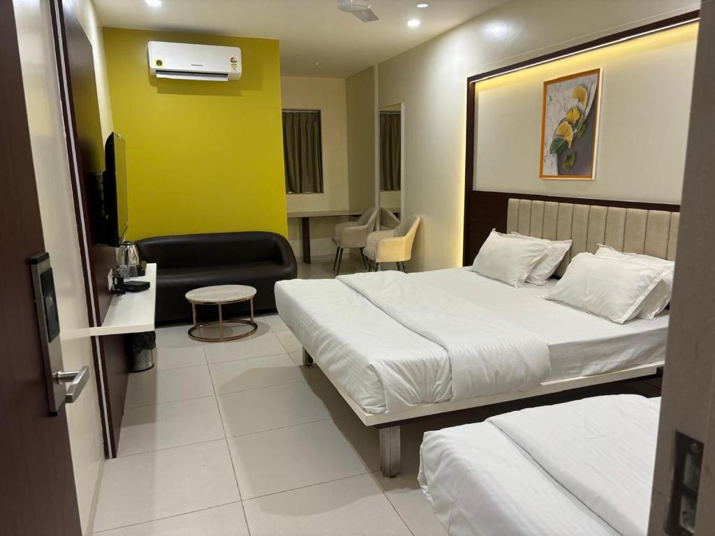Postel nebo postele na pokoji v ubytování Hotel Haldi