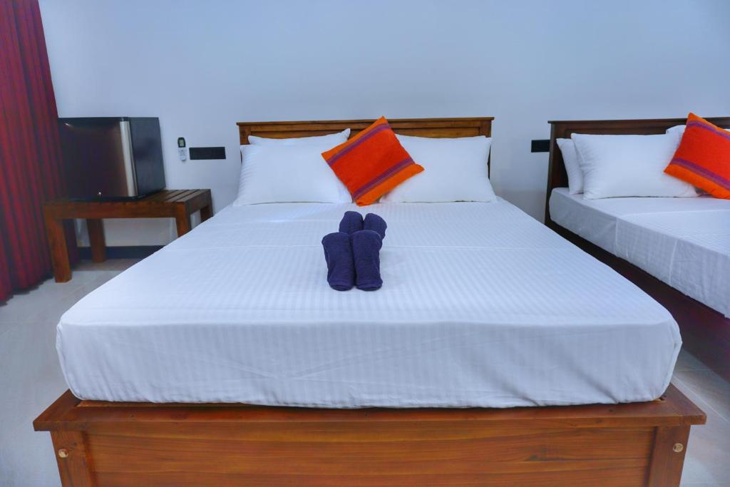 Postel nebo postele na pokoji v ubytování Golden Horizon Resort