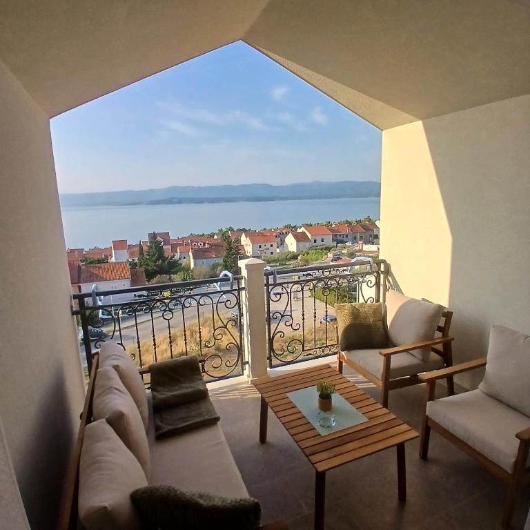 a living room with a view of the water at The Father's House in Bol