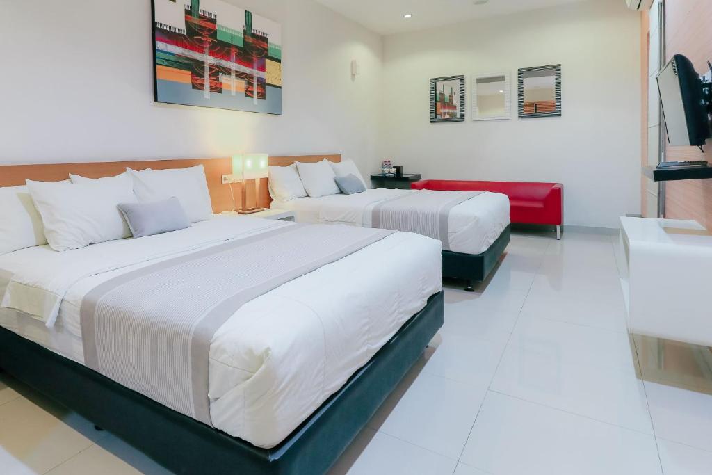Postel nebo postele na pokoji v ubytování HOME Guesthouse