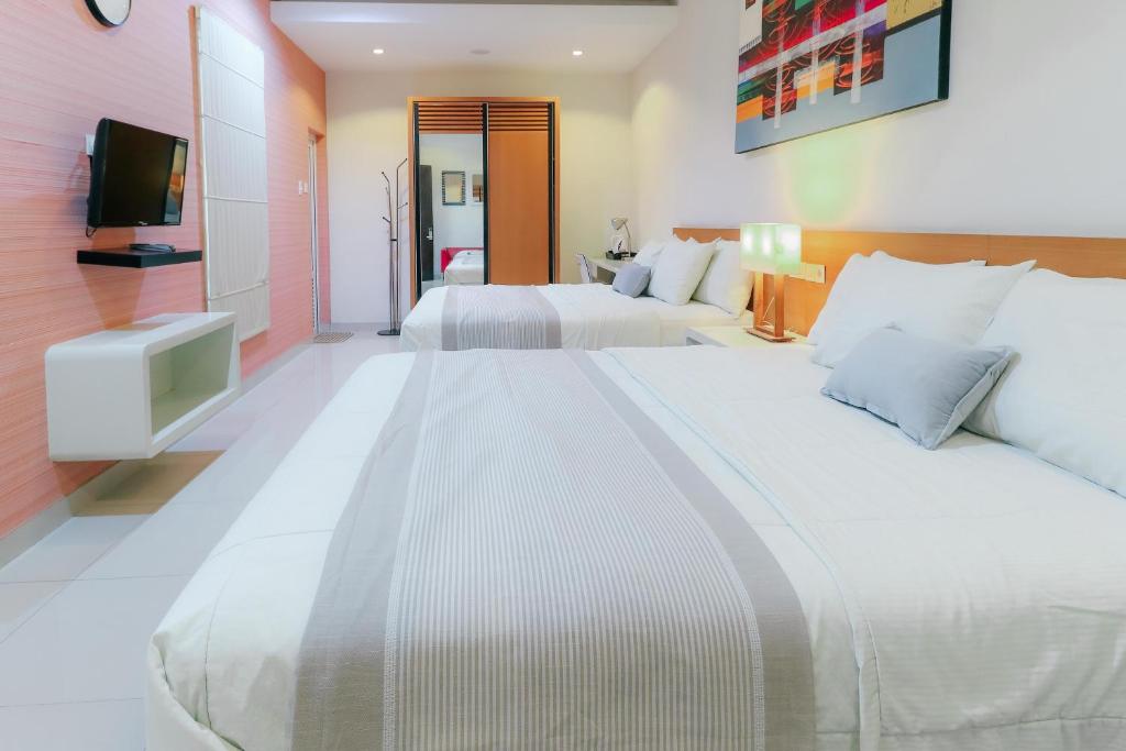 Postel nebo postele na pokoji v ubytování HOME Guesthouse