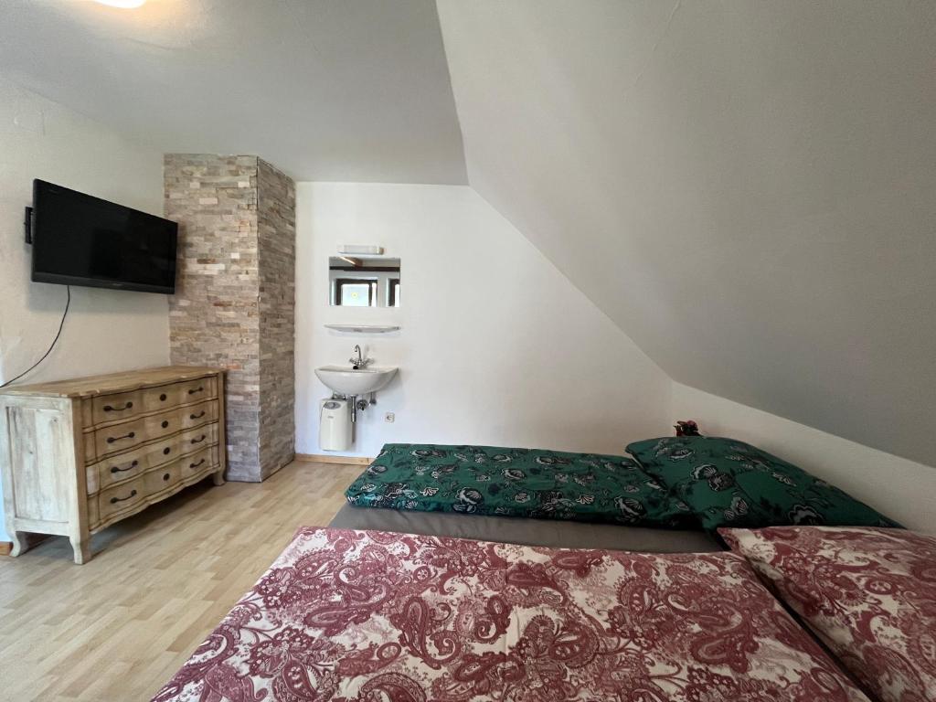 Postel nebo postele na pokoji v ubytování Sunside Apartments Gästehaus