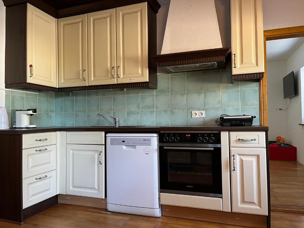 Kuchyň nebo kuchyňský kout v ubytování Sunside Apartments Gästehaus