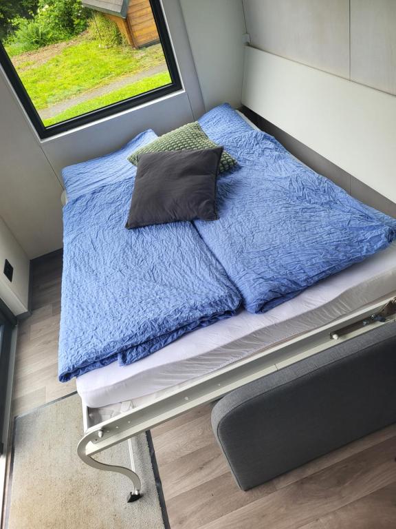 Postel nebo postele na pokoji v ubytování Bigge Elements Tinyhaus 4 "Magie"