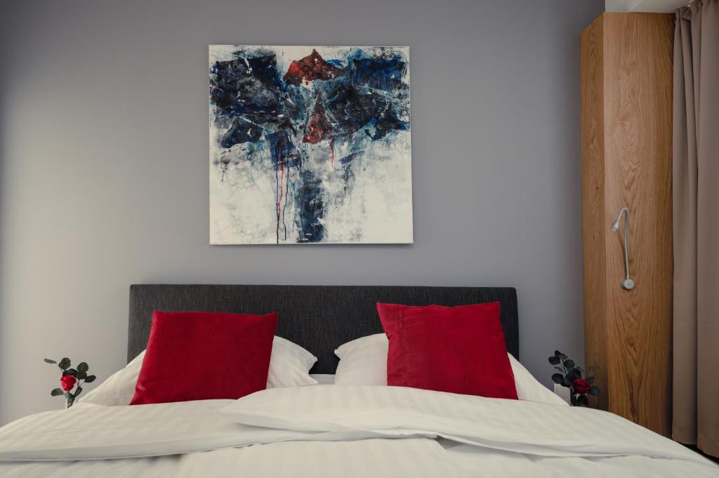 Кровать или кровати в номере Kaiser Apartments - Wohnpark Graz-Gösting