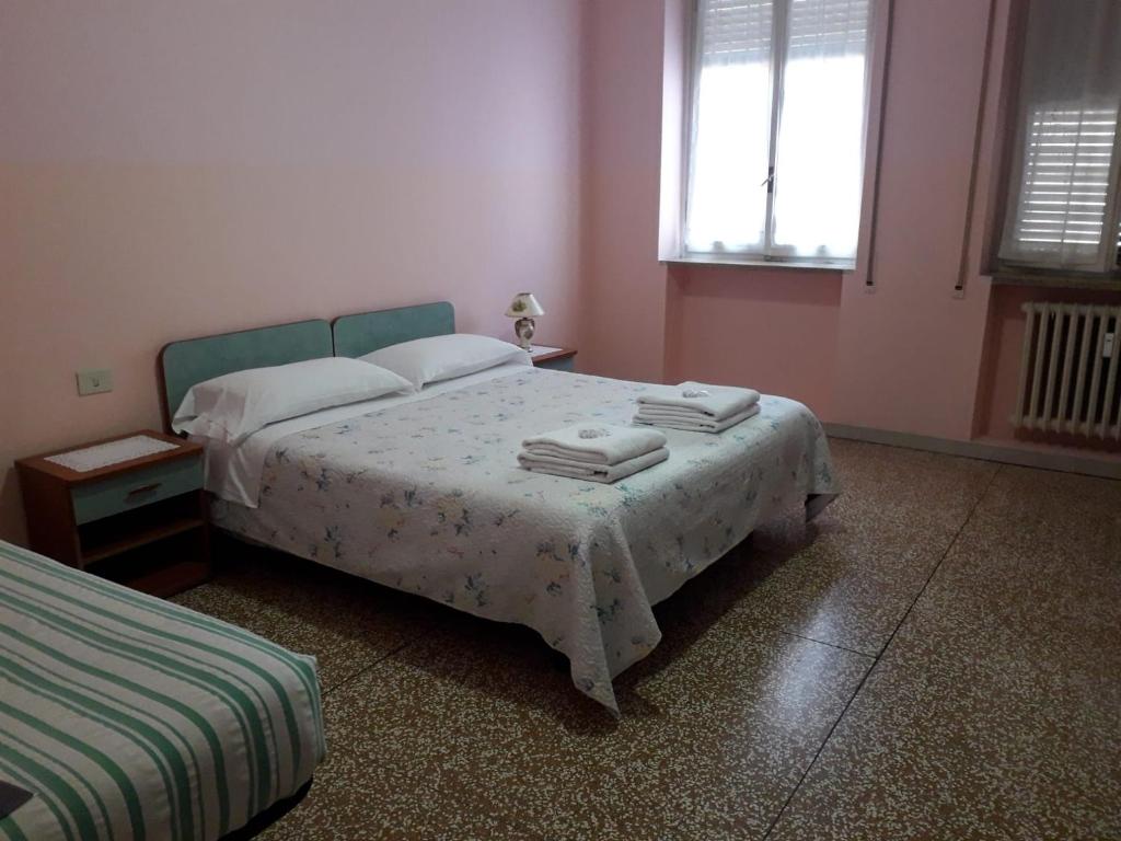 Ένα ή περισσότερα κρεβάτια σε δωμάτιο στο B&B Silvano