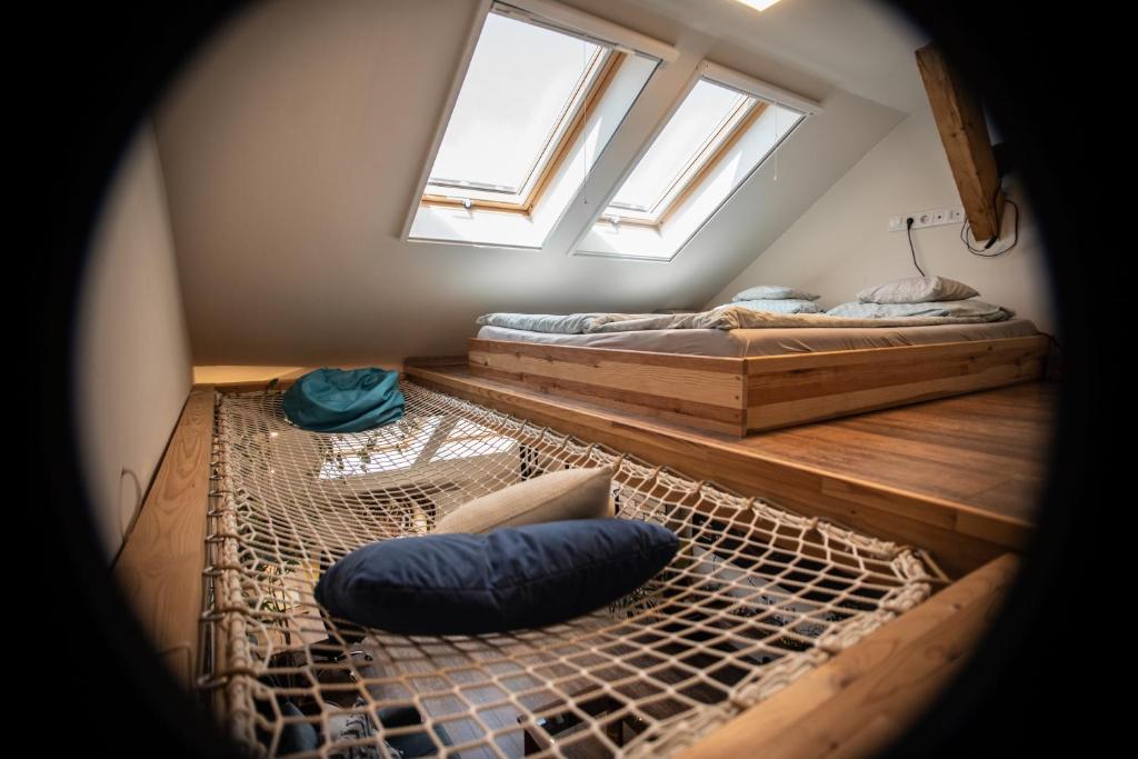 A bed or beds in a room at Treehouse apartment