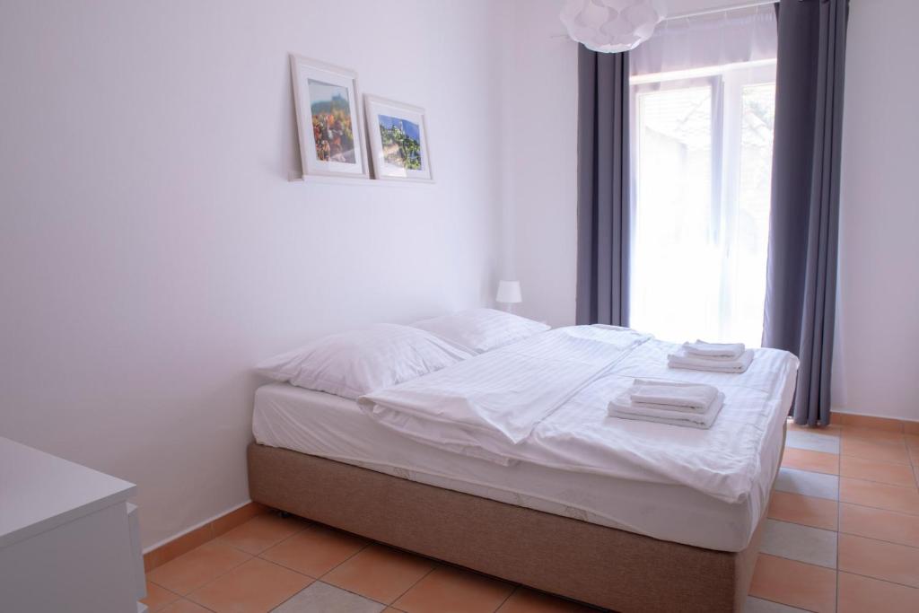 Postel nebo postele na pokoji v ubytování Amenity Apartmány Perná