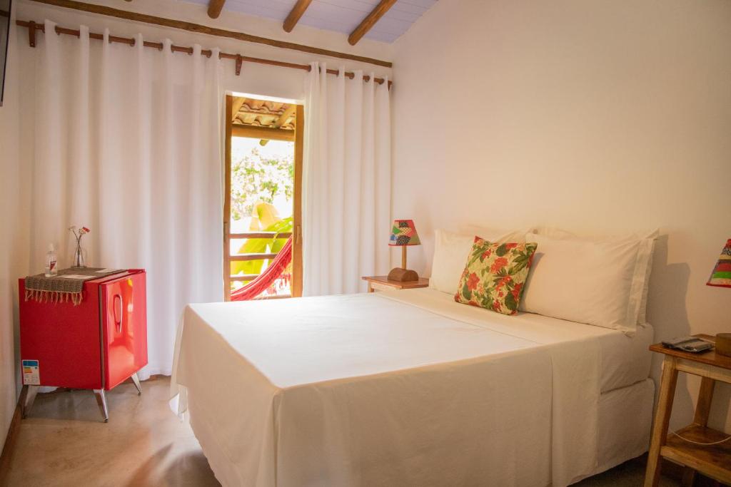 Postel nebo postele na pokoji v ubytování Casa de Paixão Caraíva