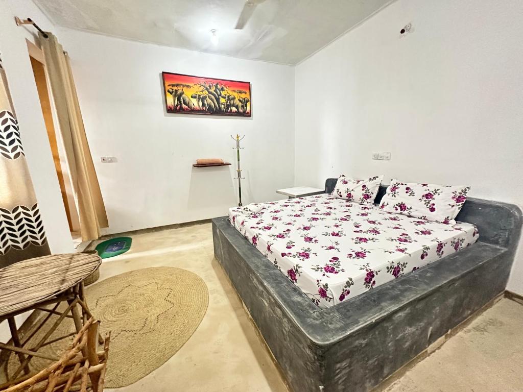 Postel nebo postele na pokoji v ubytování Mbuyuni Lodge Nungwi