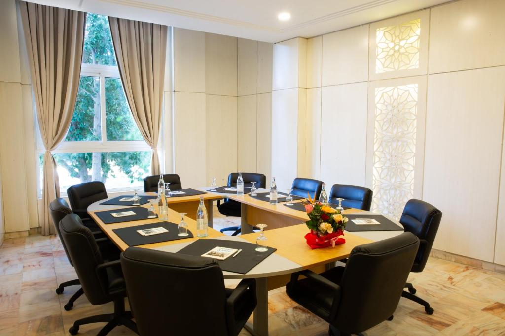 a conference room with a long table and chairs at Marhaba Royal Salem - Family Only in Sousse