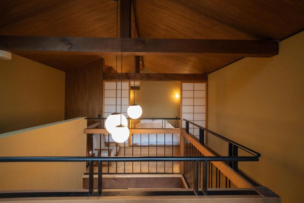 Postel nebo postele na pokoji v ubytování 京都松澗Matsutani