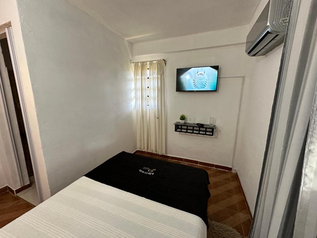 TV a/nebo společenská místnost v ubytování Posada Turistica Alborada