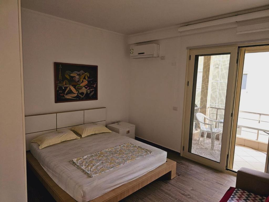 Postel nebo postele na pokoji v ubytování MiniCoco Apartment
