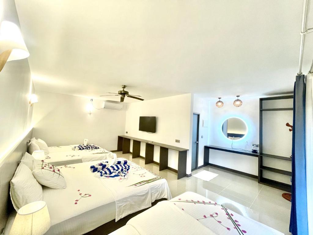 Postel nebo postele na pokoji v ubytování La Palma Suites