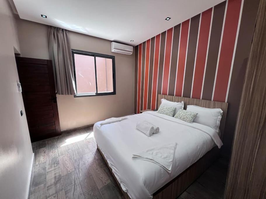 Postel nebo postele na pokoji v ubytování Appartement No 1 vue sur la cour