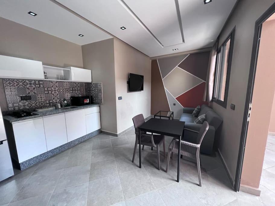 Kuchyň nebo kuchyňský kout v ubytování Appartement No 1 vue sur la cour