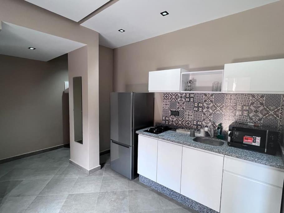 Kuchyň nebo kuchyňský kout v ubytování Appartement No 1 vue sur la cour