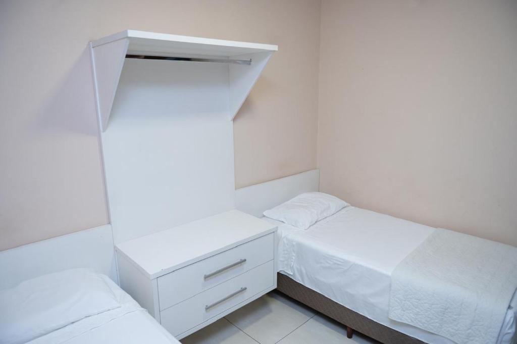 Postel nebo postele na pokoji v ubytování Hotel Alibertti