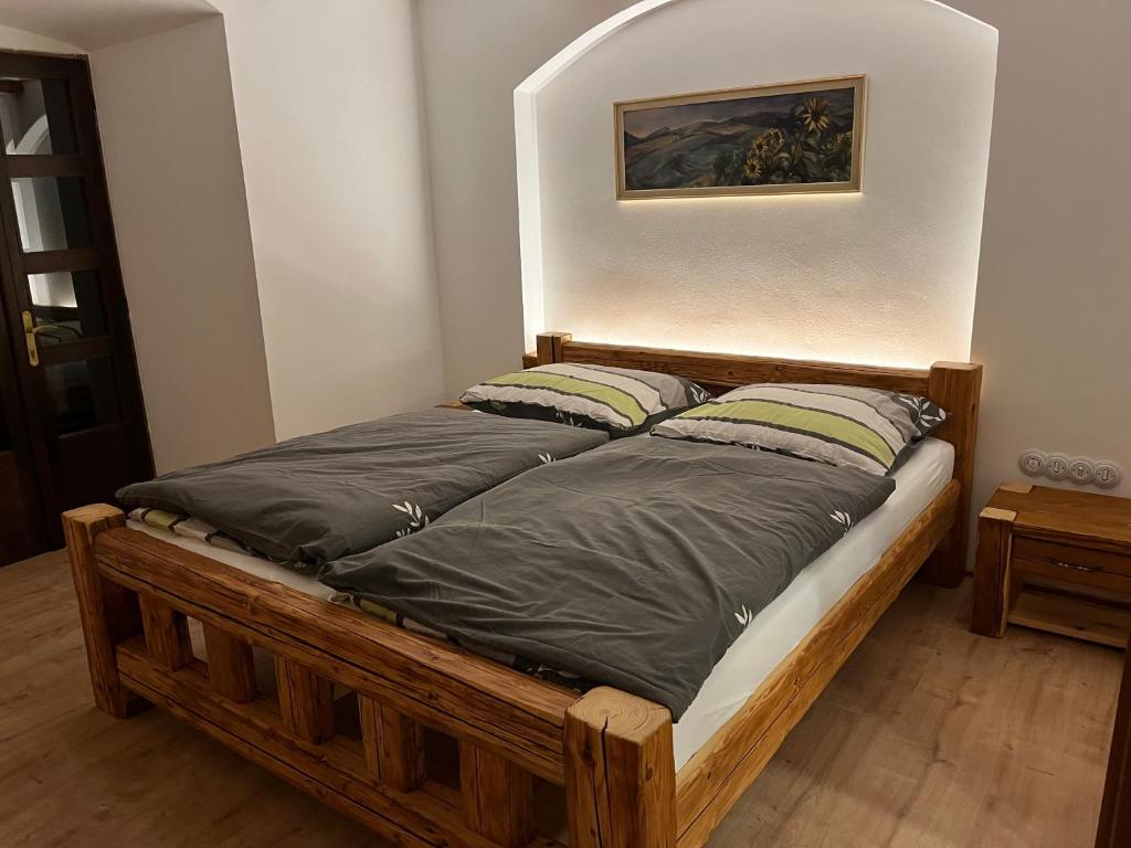 Postel nebo postele na pokoji v ubytování Barokní dům u Panny Marie