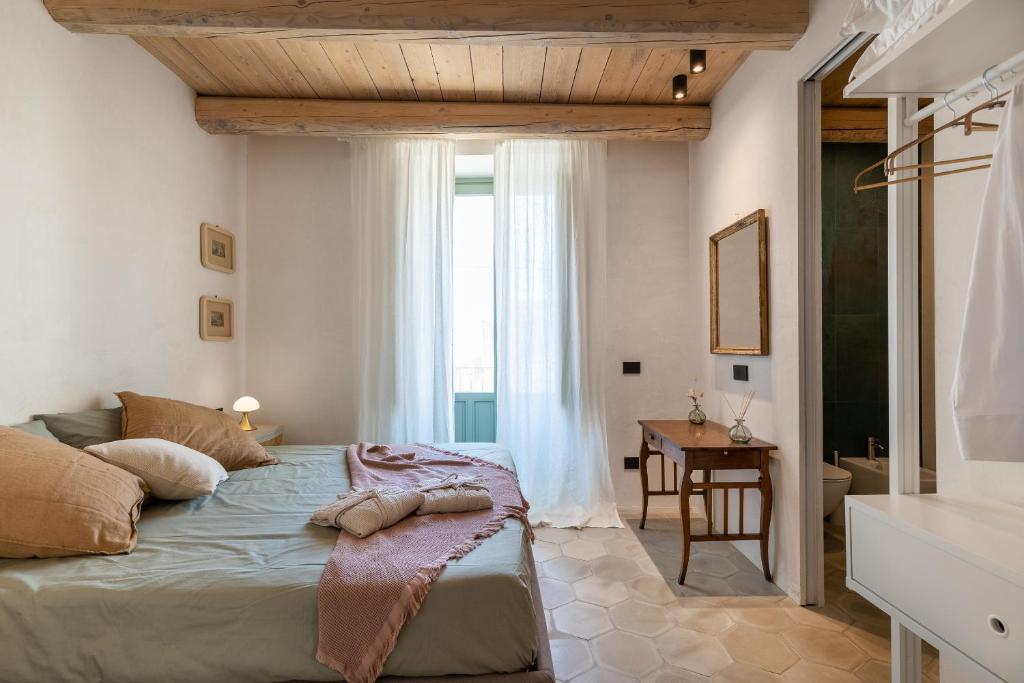 Ένα ή περισσότερα κρεβάτια σε δωμάτιο στο Vico Palma Apartament