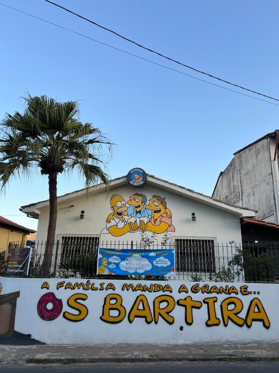 a building with a sign on the side of it at República Os Bartira in Ouro Preto