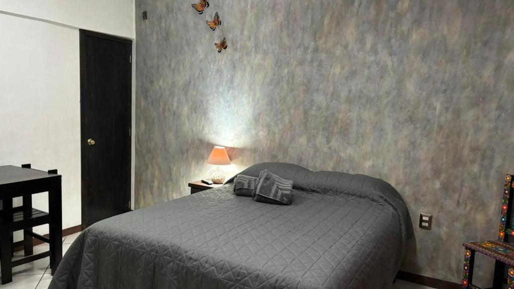 Letto o letti in una camera di Casa los Arcos Oaxaca