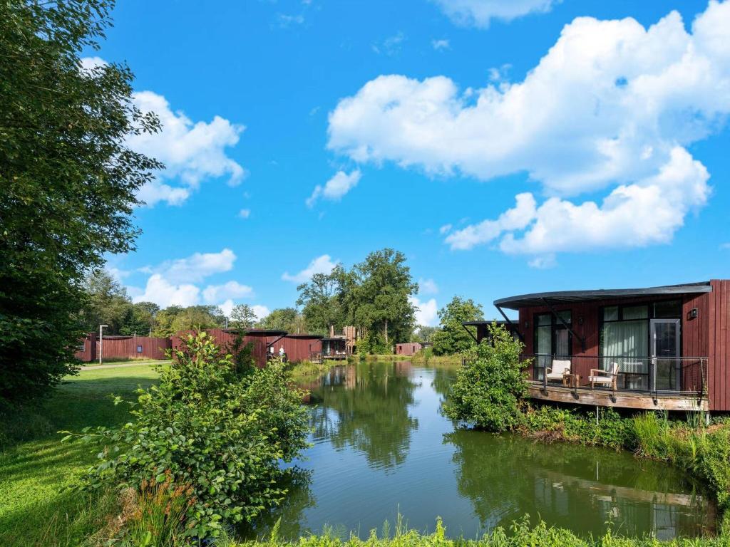 a view of a river with a house at Bungalow Near Forest & Lake in Antoing