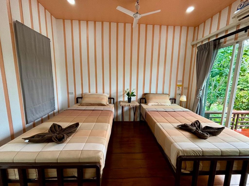 BAAN APA ERAWAN Resortにあるベッド