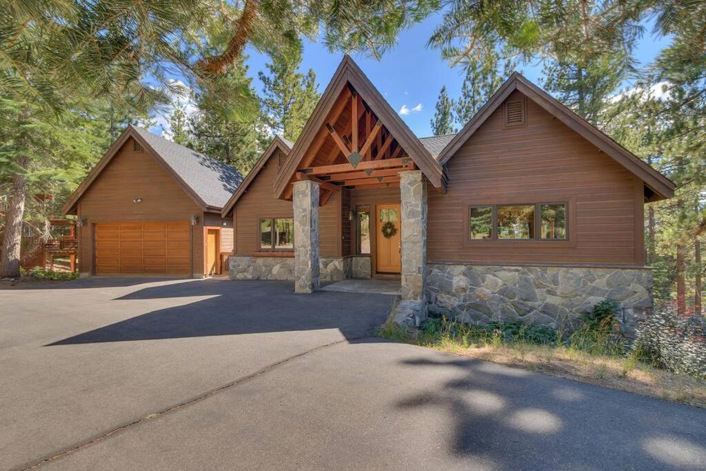 a home with a wooden house with a driveway at On Tahoe Time - Pets Pool Table Game Room in South Lake Tahoe