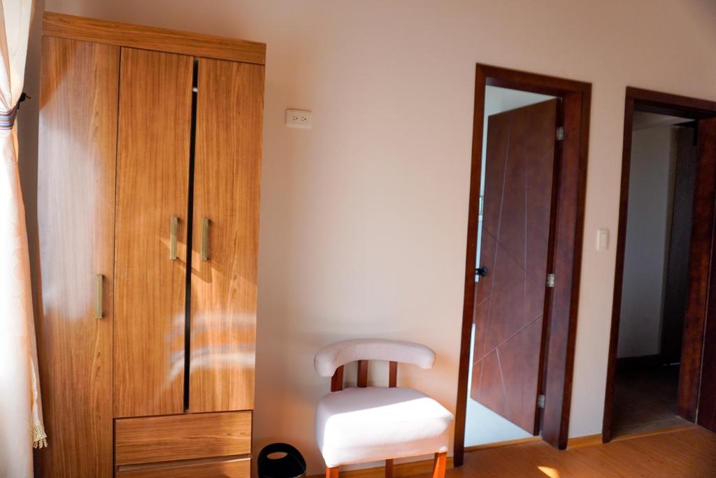 Postel nebo postele na pokoji v ubytování Laguna de Cuicocha Guest House