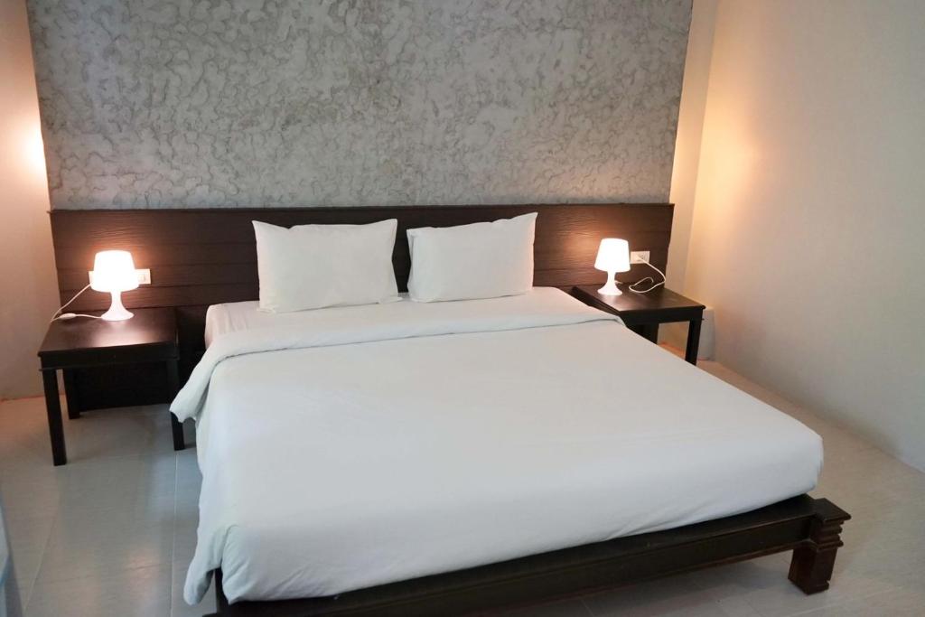 Postel nebo postele na pokoji v ubytování Khaolak Suthawan Resort - SHA Plus