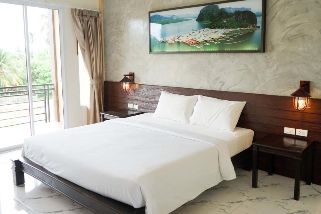 Postel nebo postele na pokoji v ubytování Khaolak Suthawan Resort - SHA Plus
