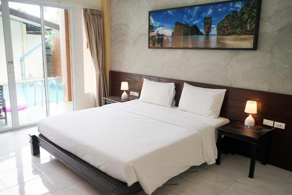 Postel nebo postele na pokoji v ubytování Khaolak Suthawan Resort - SHA Plus