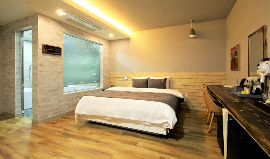 Postel nebo postele na pokoji v ubytování Jade hotel
