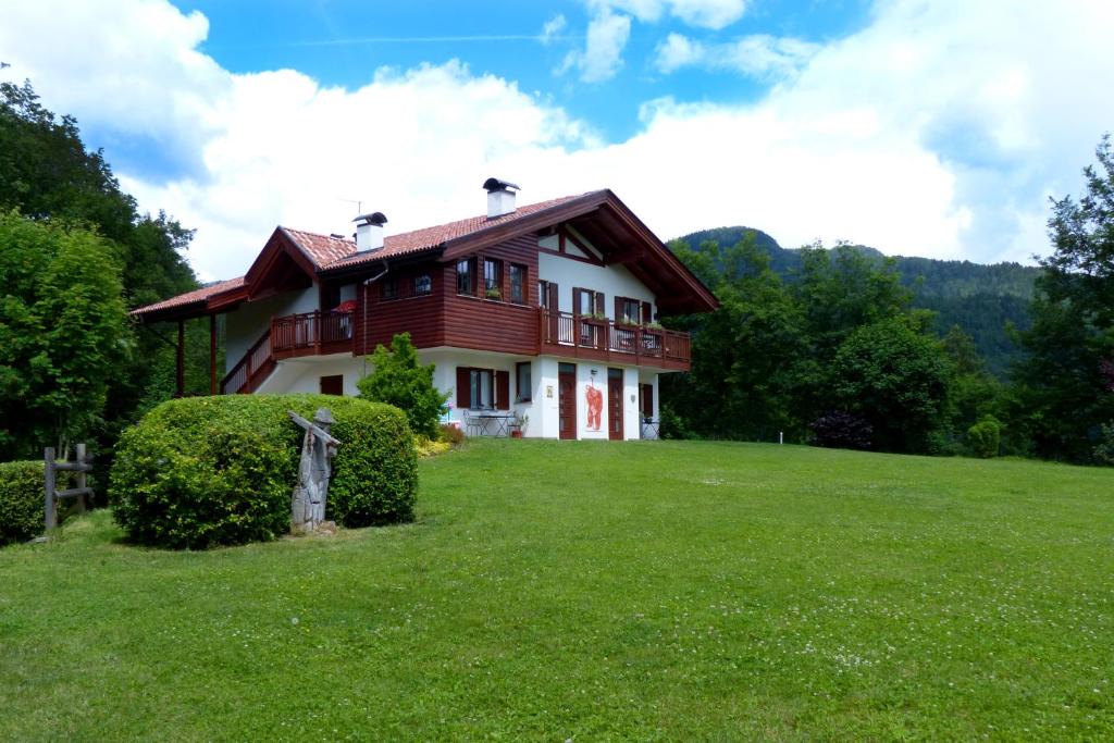 a house on a hill with a green field at Green Valley in Montagnaga