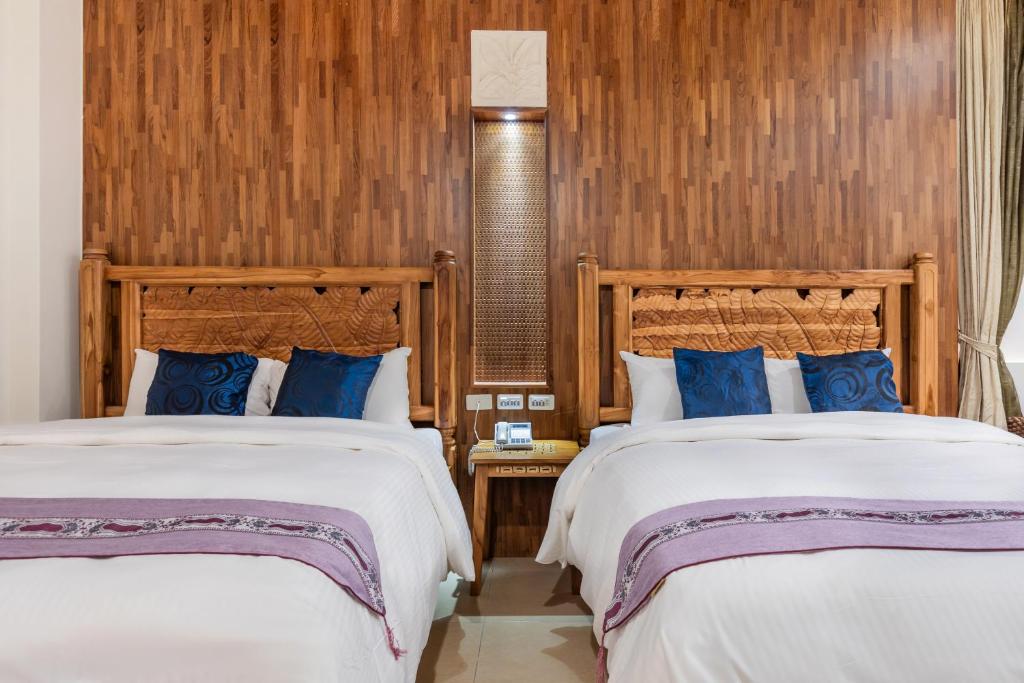 Postel nebo postele na pokoji v ubytování Kenting Shen's Homestay