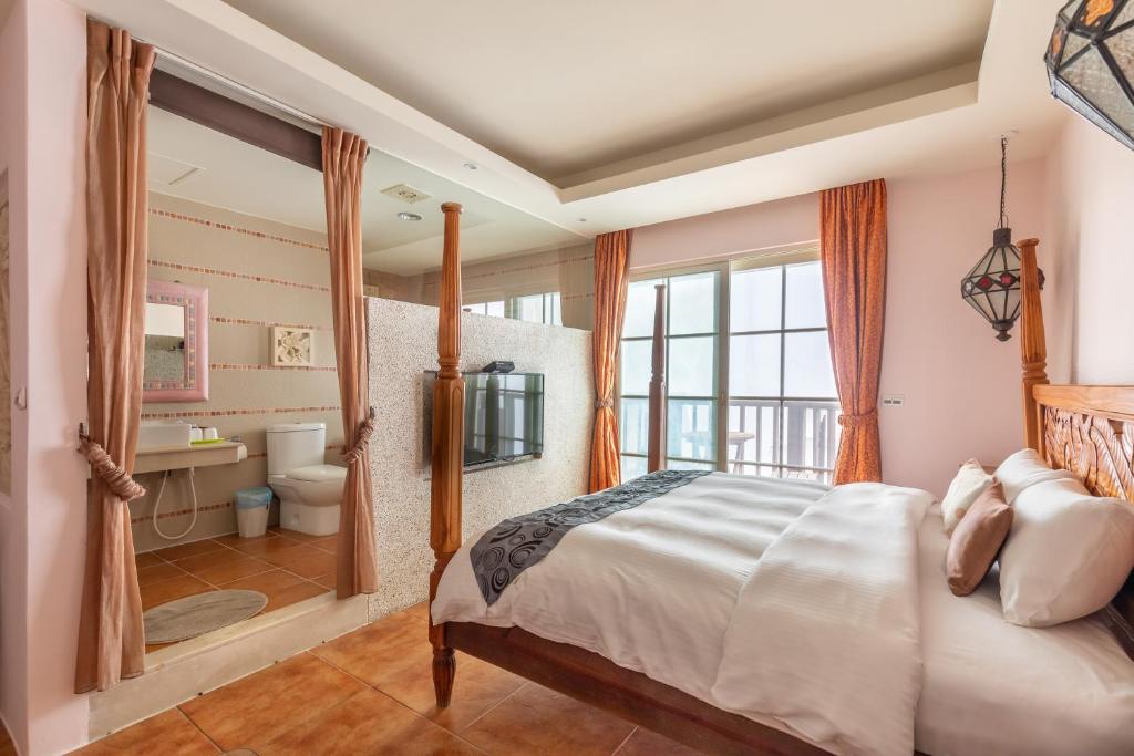 Postel nebo postele na pokoji v ubytování Kenting Shen's Homestay