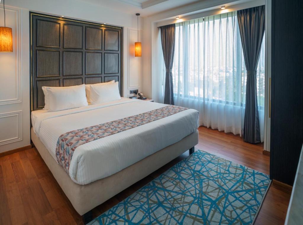 Postel nebo postele na pokoji v ubytování Hotel SOOT