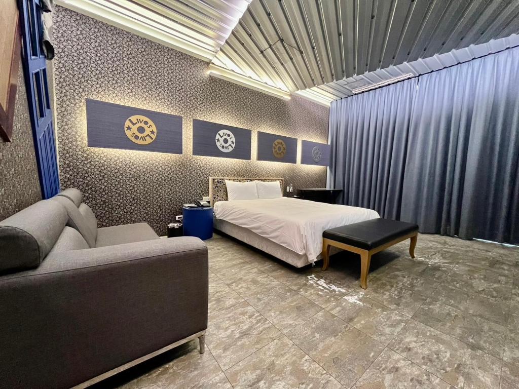 Postel nebo postele na pokoji v ubytování 第八月台九號行館No9 Hotel