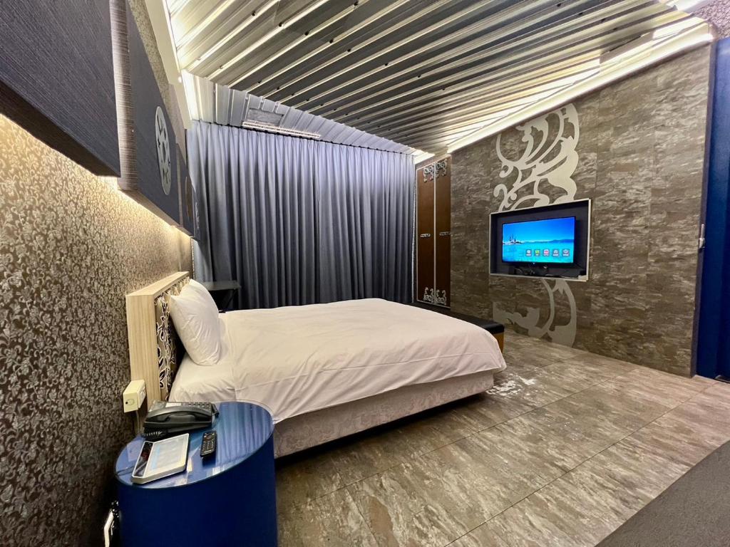 Postel nebo postele na pokoji v ubytování 第八月台九號行館No9 Hotel