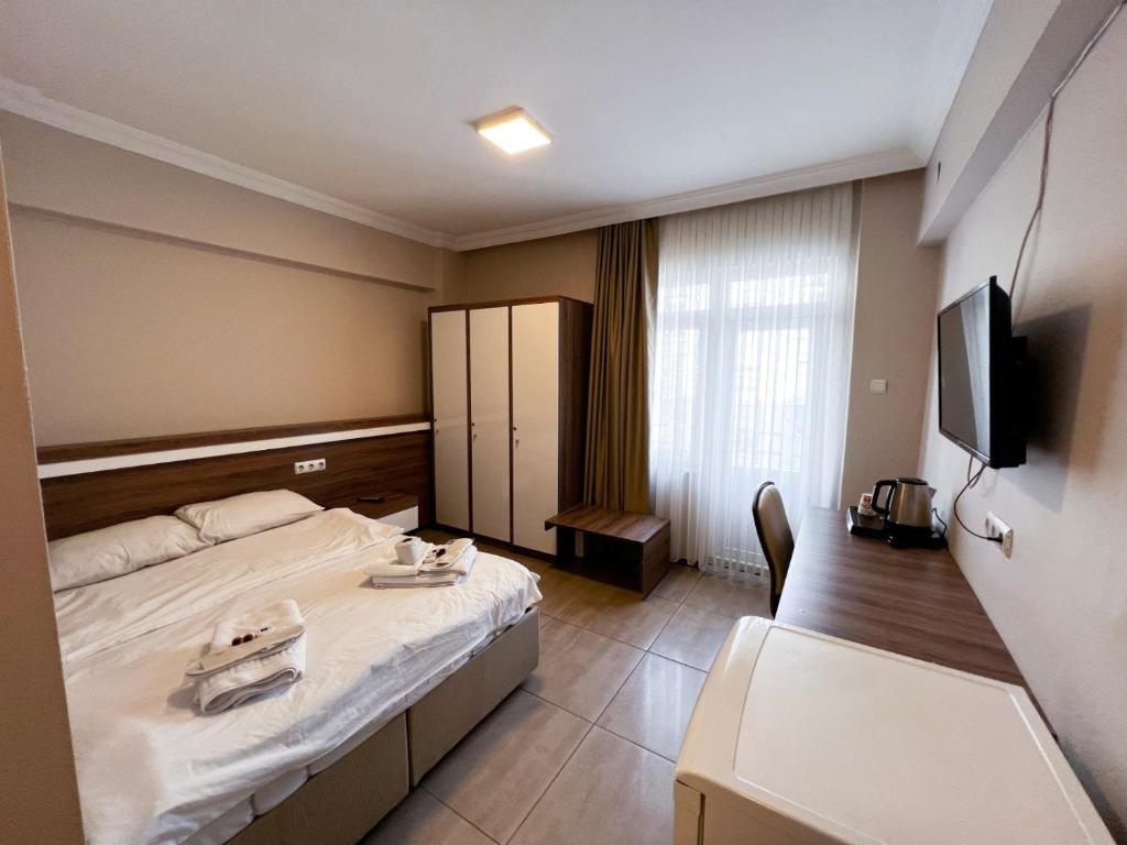 En eller flere senge i et værelse på Beyazhan Otel