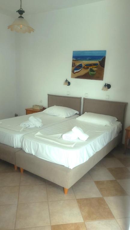 Postel nebo postele na pokoji v ubytování Akteon Hotel