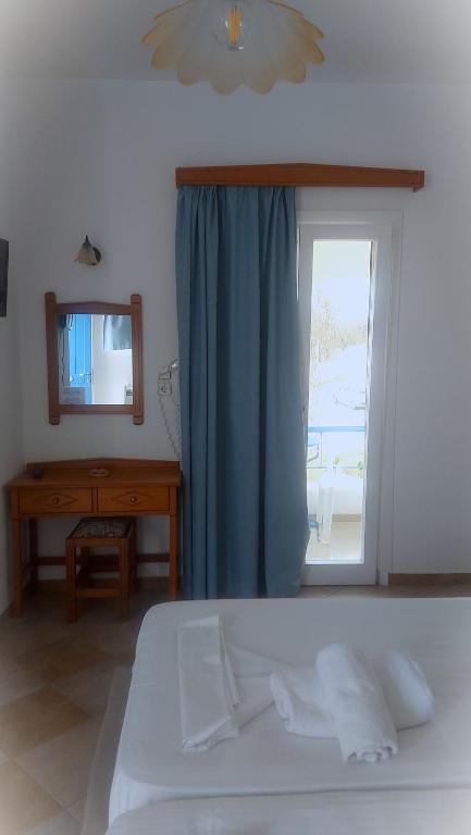 Postel nebo postele na pokoji v ubytování Akteon Hotel